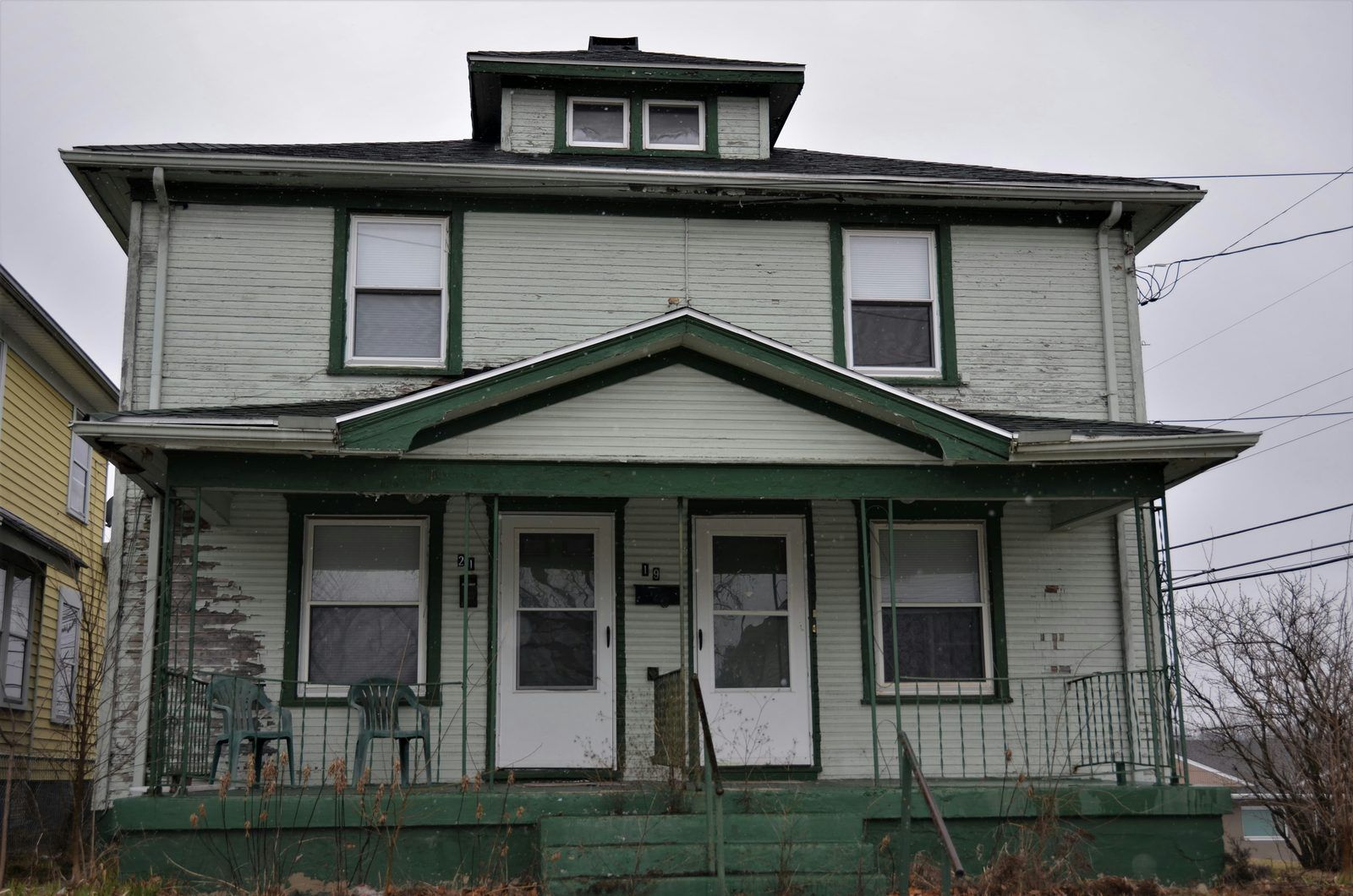 Traditional craftsman-style home with a front porch and dormer windows